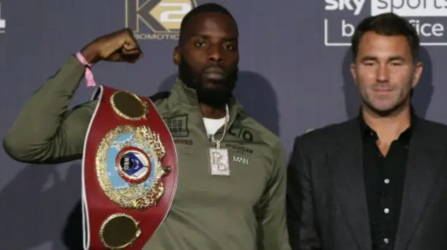 Lawrence Okolie and Eddie Hearn stand together