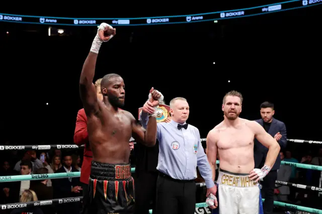 Lawrence Okolie has his hand raised by the judge