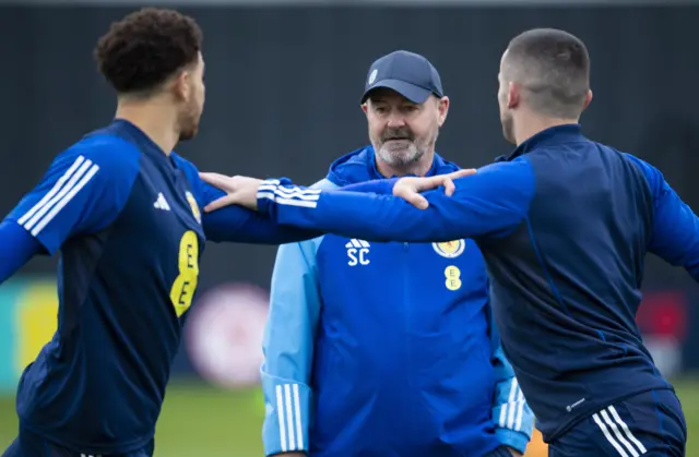 Che Adams, Steve Clarke and John McGinn in Scotland training