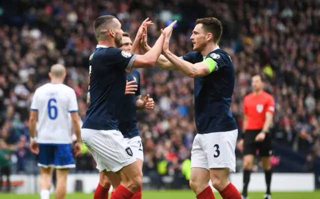 John McGinn and Andy Robertson celebrate