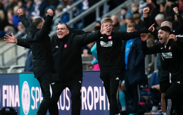 The Accies bench - John Rankin, George Cairns, Matthew Shiels and Andy Winter - celebrate at full-time