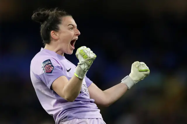 Liverpool goalkeeper Rachael Laws celebrates her side's first goal against Everton