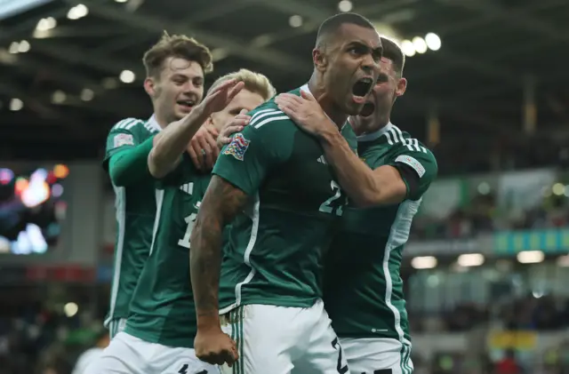 Josh Magennis celebrates his winner