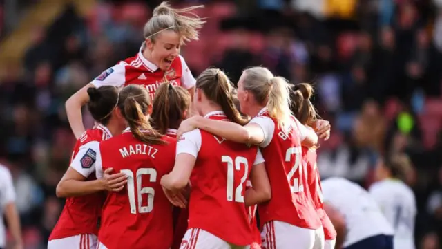 Arsenal celebrate scoring against Tottenham