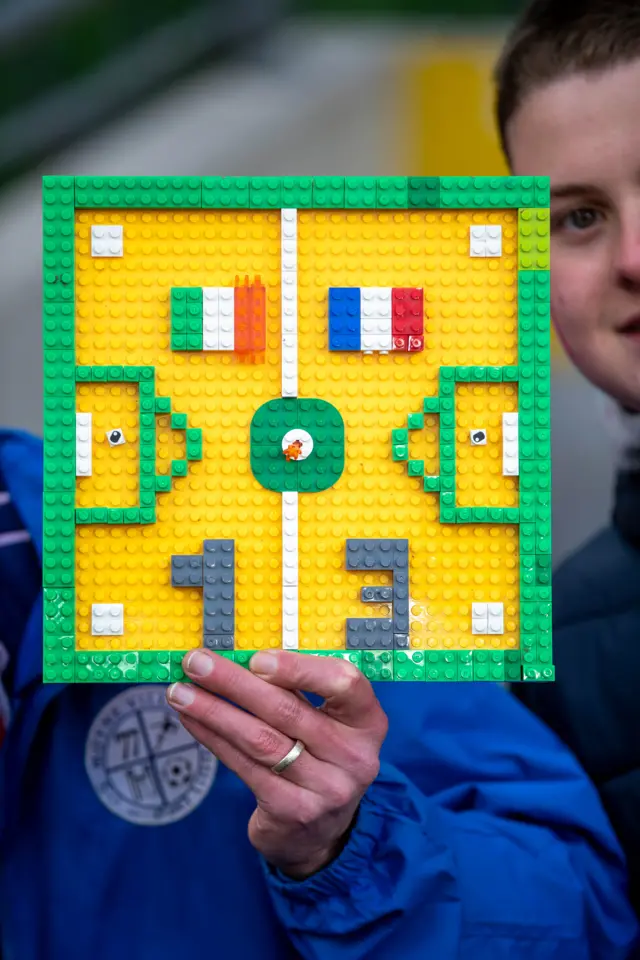 French fans with a lego prediction before the game