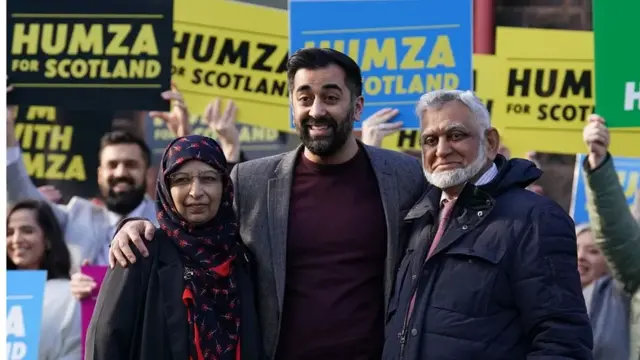 Mr Yousaf with his parents Shaaista and Muzaffar