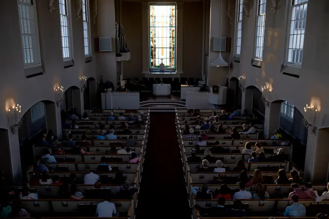 People attend a vigil at Woodmont Christian for those who were killed in the mass shooting