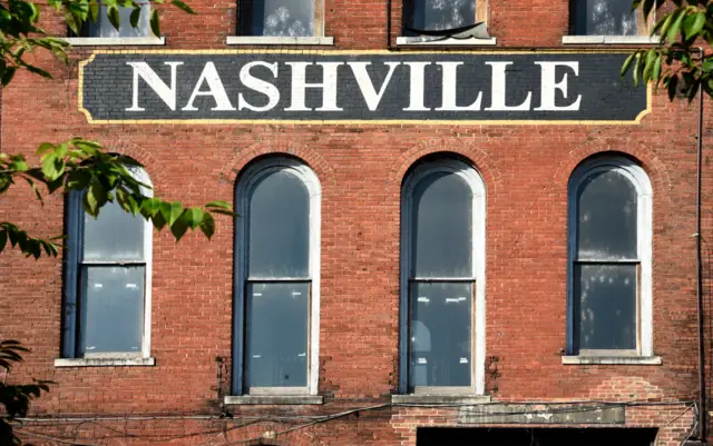 The facade of a 19th century brick warehouse along the Cumberland River in downtown Nashville, Tennessee.