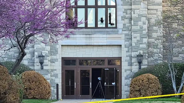 The Covenant School in Nashville with police tape in front of it and damaged windows