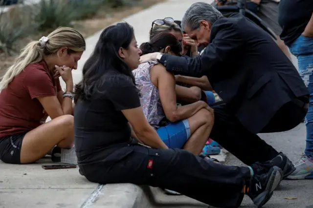 Relatives of Uvalde victims are comforted in the aftermath