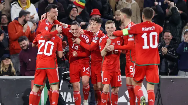 Wales celebrate Kieffer Moore's goal