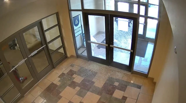 Shattered glass in front doors of school