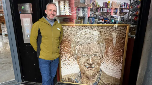 Martin Davies from Newport with the jelly bean portrait of Paul O'Grady