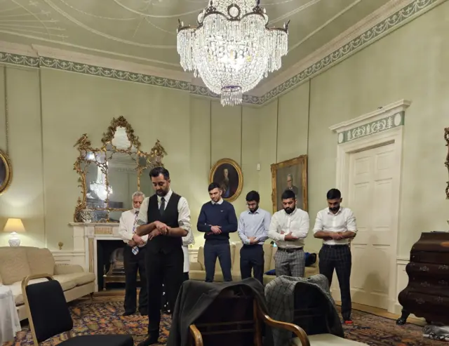 Humza and family praying