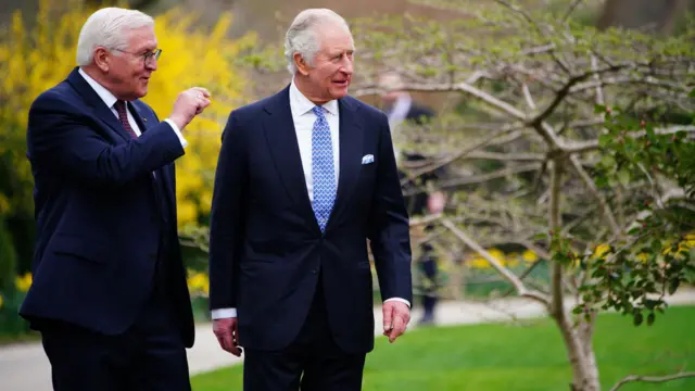 King Charles and German President Frank-Walter Steinmeier in the presidential palace gardens