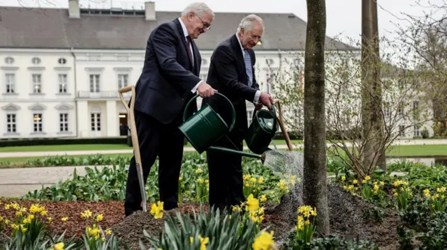 King Charles III and German President Frank-Walter Steinmeier in the garden of the presidential palace