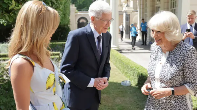 Queen Consort Camilla speaks to Amanda Holden and Paul O'Grady as she hosts a reception at Clarence House, London, to mark the Battersea Dogs and Cats Home's 160th anniversary