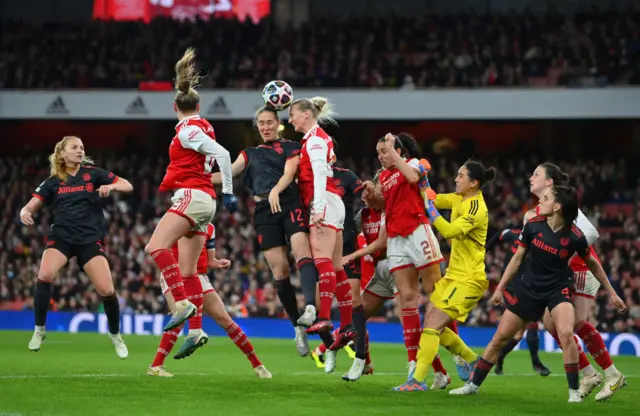 Sydney Lohmann of FC Bayern Munich battles for a header with Stina Blackstenius