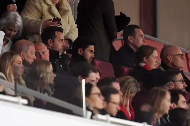 Mikel Arteta watching on