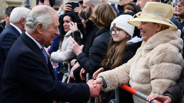 Charles greets the public