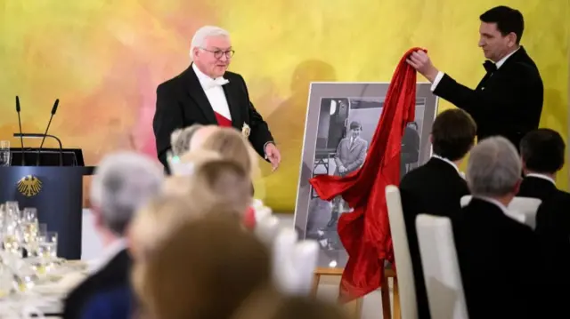 Federal President Frank-Walter Steinmeier speaks at the state banquet given by President Steinmeier in honour of King Charles III and Queen Camilla at Bellevue Palace and unveils a gift from President Steinmeier: a childhood photograph of Charles' first visit to Germany, alongside his father, in Berlin, Germany, March 29, 2023.