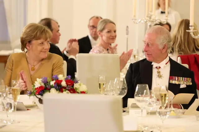 Former German Chancellor Angela Merkel and Britain's King Charles III attend a state banquet at Schloss Bellevue presidential palace in Berlin, Germany, 29 March 2023