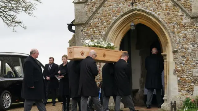 The coffin of former Speaker of the House of Commons Betty Boothroyd is carried into St George's Church, Thriplow, Cambridgeshire ahead of her funeral