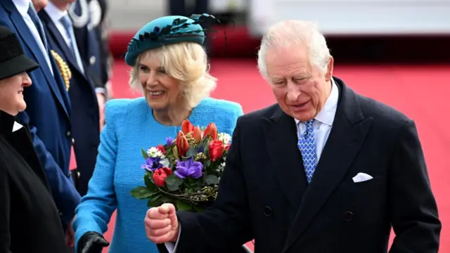 The royal couple greeted by officials