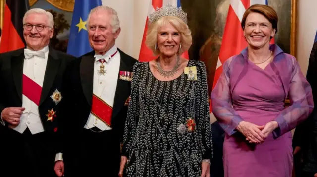 German President Frank-Walter Steinmeier, left, his wife Elke Buedenbender, right, Britain's King Charles III, 2nd left, and Camilla, the Queen Consort, stand together prior to the State Banquet in Berlin, Wednesday, March 29, 2023.