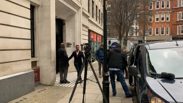 Reporters outside Wogan House