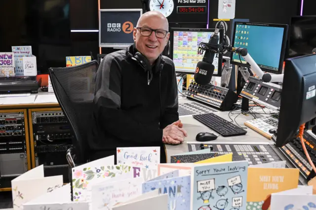 Ken Bruce in the studio, with many thank you cards in front of him