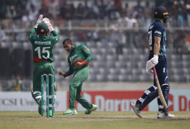 Mehidy Hasan celebrates the wicket of Dawid Malan