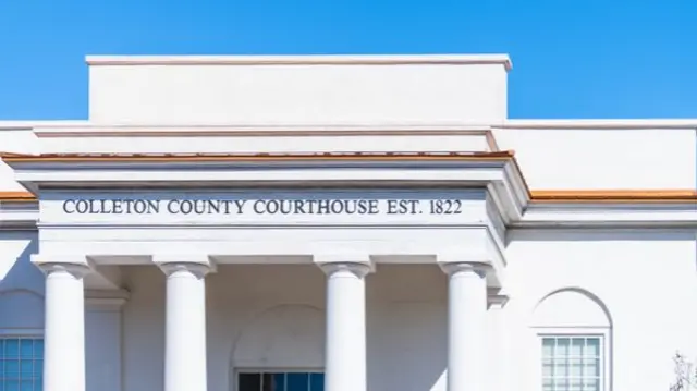 Walterboro, USA Colleton county courthouse clerk of court building sign at white architecture facade in South Carolina city