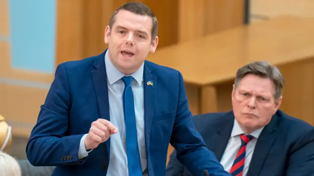 Douglas Ross asks a question at FMQs