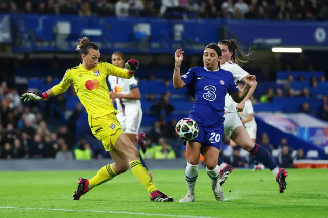 Christine Endler of Olympique Lyonnais clears a shot from Sam Kerr