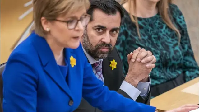 Humza Yousaf sat next to Nicola Sturgeon at her final FMQs last week