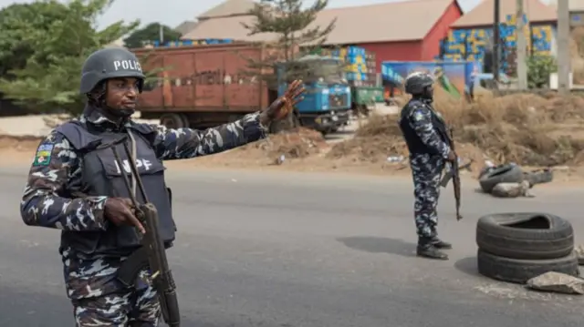 Nigerian police patrol during general elections in February