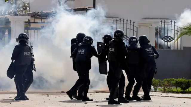 Security forces fire tear gas and stunt grenades to confine inside a campus students and supporters of Senegal opposition leader Ousmane Sonko, in Dakar