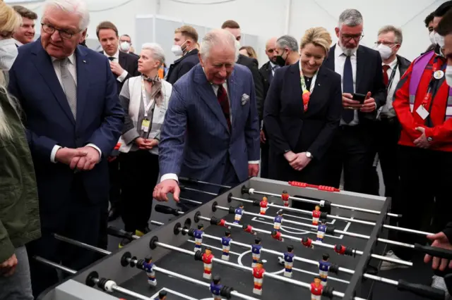 King Charles playing table football