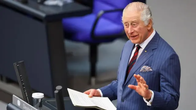 King Charles III smiles as he addresses the Bundestag