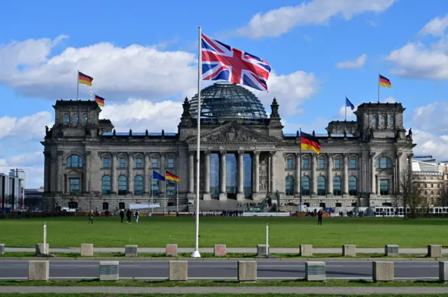 The Union Jack flies in front of the Reichstag building that houses the Bundestag