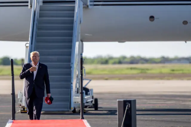 Former U.S. President Donald Trump arrives during a rally at the Waco Regional Airport on March 25, 2023 in Waco, Texas.