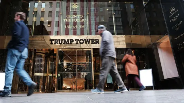 People walk past Trump Tower in New York