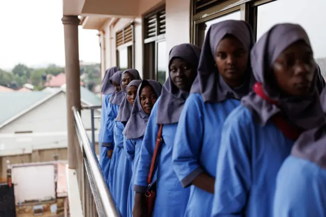 Uganda students queue for breakfast at a training facility for domestic workers in November 2022