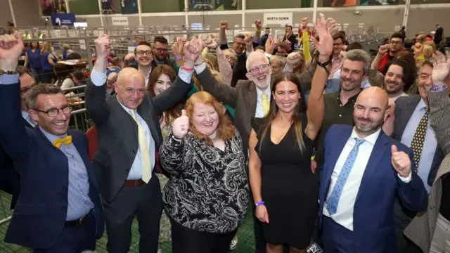 Alliance Party members celebrate their success in the Northern Ireland Assembly election in 2022