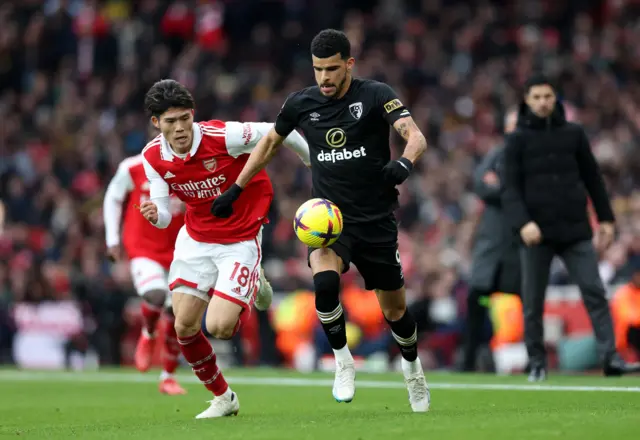 Bournemouth striker Dominic Solanke takes on Arsenal