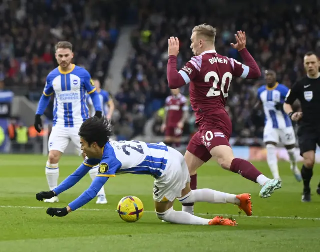 West Ham United's Jarrod Bowen fouls Brighton & Hove Albion's Kaoru Mitoma