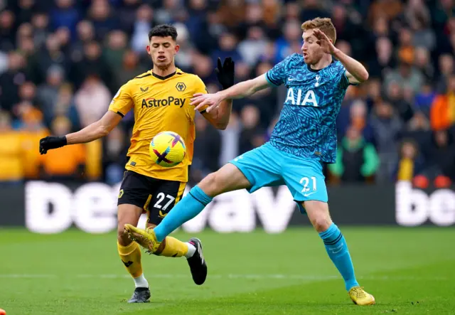 Wolverhampton Wanderers' Matheus Nunes battles with Tottenham's Dejan Kulusevski