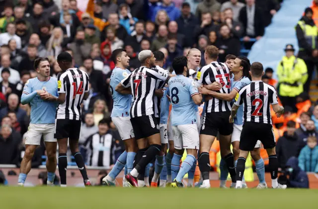 Manchester City and Newcastle players clash at the Etihad