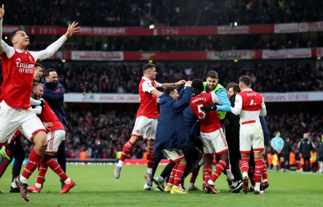 Arsenal celebrate beating Bour nemouth